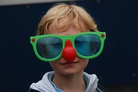 Portrait of Child with Clown Glasses on his face