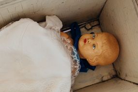 antique doll in the crib