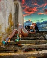 Girl on the stairs and sunset