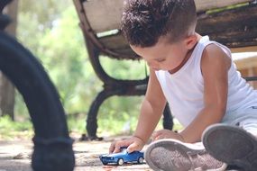 boy playing with a toy machine