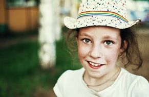 summer photo of a girl in a panama hat
