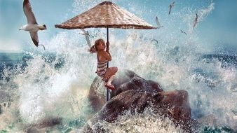 girl under a beach umbrella against the backdrop of large ocean waves