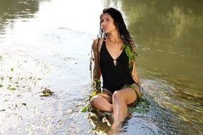 girl in water in wild nature