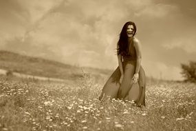 smiling brunette on the meadow