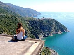 Girl Sitting on a ledge