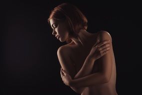 naked girl model in a dark