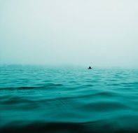 distant Boat in Blue Sea