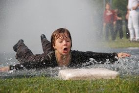 boy in the water after rain