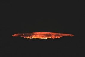 people silhouette near volcano crater