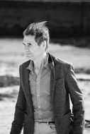 black and white portrait of a walking man