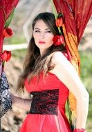 girl with beautiful eyes in a red dress