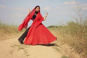 dancing indian woman in red sari