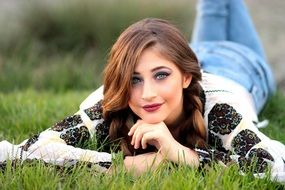 attractive model on the green grass
