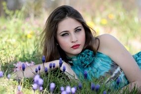 model with blue eyes in the spring meadow