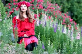 model in flower wreath in the garden