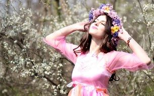 girl in a colorful wreath as a symbol of spring
