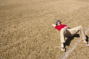 Picture of Sleeping Man on a field