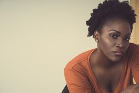 portrait of a black woman on a chair