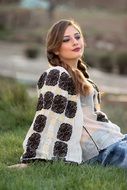 young woman resting on the meadow