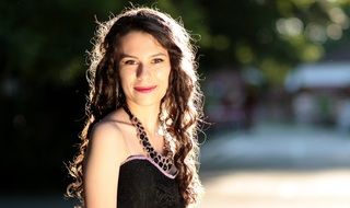 young girl with long curly hair
