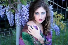 sensual woman on the violet flowers background