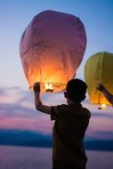 night lanterns with fire in hands