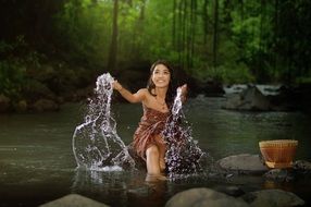 beautiful girl in spray of water
