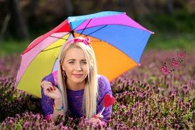 girl under a colored umbrella
