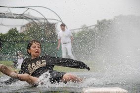 children in the water after rain