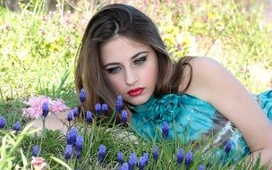 model with blue eyes on the spring meadow