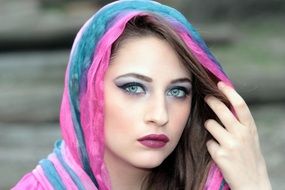 model with blue eyes and covered head