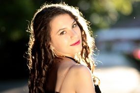 portrait of a young woman with curly hair