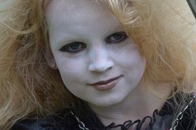 child with witch make up