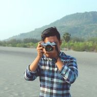 photographer with a camera near the water