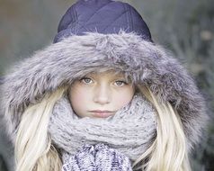 portrait of a beautiful blonde girl in winter