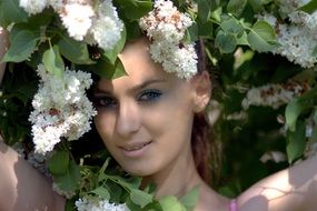 Girl in lilac flowers portrait