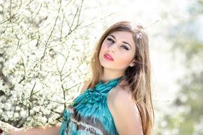 woman with blue eyes in the orchard