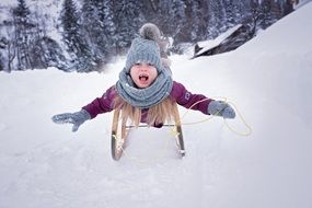 girl goes down on sleds
