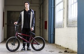 young man with a bike for extreme riding