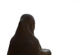 woman in shroud rear view