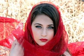 young woman with red lipstick and red scarf