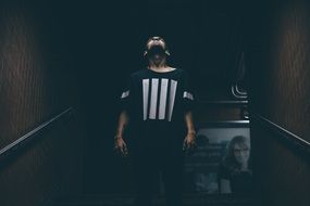 young man in a dark room