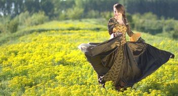 girl in a princess dress among a colorful field