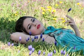 model in the blue dress on the meadow