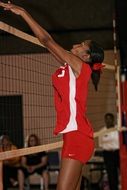 volleyball player jump in red uniform