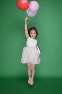 cute asian girl with balloons
