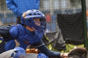 baseball player in blue uniform on the field