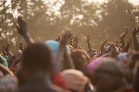 hands of a cheerful crowd of people