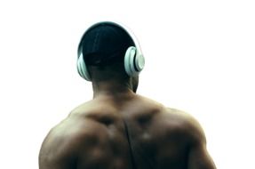 muscular man in headphones view from the back