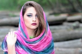 young woman with covered by scarf head